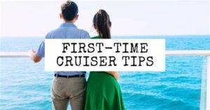 Two people looking at the ocean from a cruise ship deck, representing first-time cruisers getting valuable travel tips