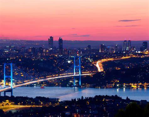 Night view of Istanbul with the illuminated Bosphorus Bridge and city lights