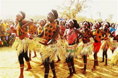 African dancers performing in colorful traditional attire