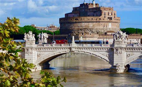 Historic Castel Sant'Angelo and ornate bridge over the Tiber River in Rome