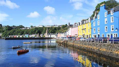 Colorful buildings along a coastal waterfront on a sunny day