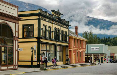 Discover the lively atmosphere of an Alaskan port town, where tourists fill the streets and a cruise ship is docked in the background. Perfect for group travel, this destination offers a blend of adventure, shopping, and cultural experiences. Ideal for family cruises, themed cruises, and maritime vacations, this port town provides an authentic and vibrant travel experience. Book with our travel agency for the best cruise deals, group discounts, and tailored travel packages. Enjoy the scenic views, local attractions, and unforgettable travel memories in this bustling Alaskan port town, making your cruise vacation truly special.