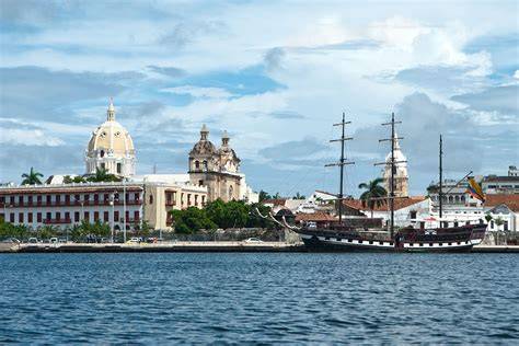 Experience the cultural richness of Cartagena, Colombia, where traditional dancers in colorful attire perform in front of a docked cruise ship. Perfect for group travel and maritime adventures, Cartagena offers a unique blend of vibrant culture and exotic beauty. Ideal for family cruises, themed cruises, and adventure cruises, this destination provides an unforgettable travel experience. Book with our travel agency for the best cruise deals, group discounts, and tailored travel packages. Enjoy the scenic views, cultural attractions, and memorable travel moments in this enchanting Colombian port, making your cruise vacation truly extraordinary.