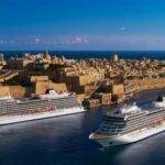 Luxury cruise ships docked at a scenic Mediterranean port, showcasing a picturesque city backdrop with historic architecture.