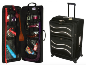 Travel luggage set with an open suitcase showing organized compartments and items, alongside a closed suitcase.