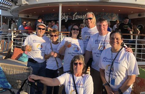 Group of people enjoying a cruise together in matching shirts