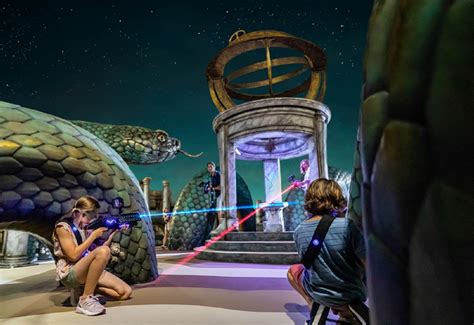 Children playing laser tag in an adventurous, themed arena onboard a cruise ship