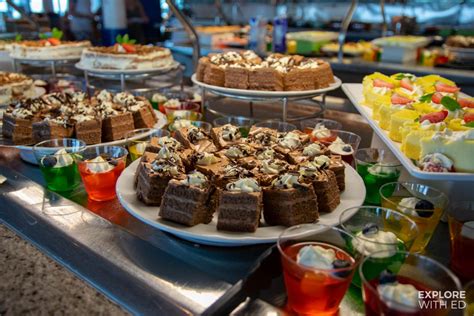 Variety of delicious desserts displayed on a buffet table on a cruise ship