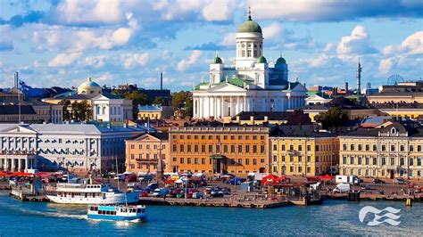 Helsinki waterfront with historic buildings and Helsinki Cathedral in the background.