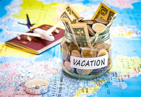 Vacation savings jar with money, passport, and toy airplane on a world map.