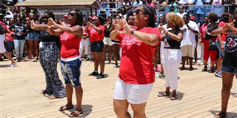 Group of women participating in a dance activity on a cruise ship deck