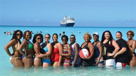 Group of women Africans in America enjoying a beach day with a cruise ship in the background