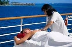 Relaxing outdoor massage on a cruise ship deck with ocean view.