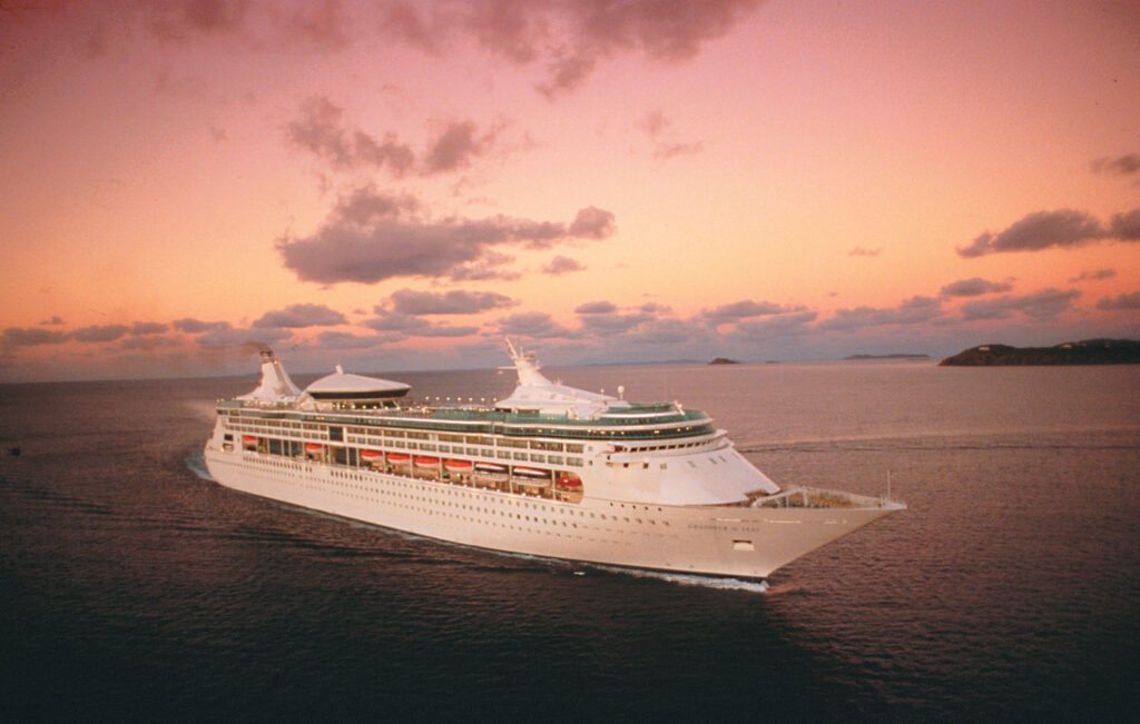 Cruise ship sailing at sunset representing a Sydney cruise arrival